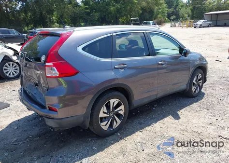 2016 Honda Cr-V Touring z USA, uszkodzony, nr VIN 5J6RM4H97GL097321